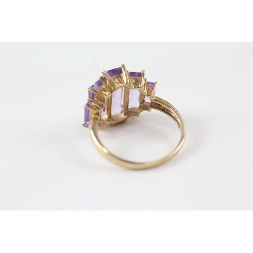 91 - 9ct gold amethyst five stone cocktail ring with diamond sides (3.8g) Size  P