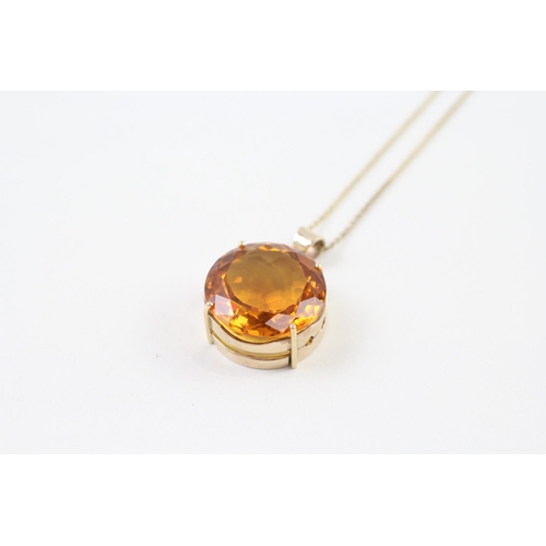 99 - 9ct gold citrine round single stone pendant necklace (10.4g)