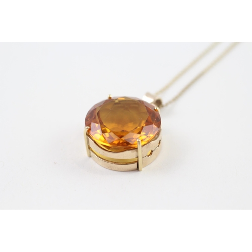 99 - 9ct gold citrine round single stone pendant necklace (10.4g)