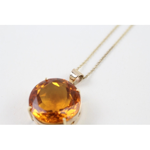 99 - 9ct gold citrine round single stone pendant necklace (10.4g)