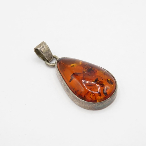 180 - Selection of silver and amber pendants HM  53.1g in total