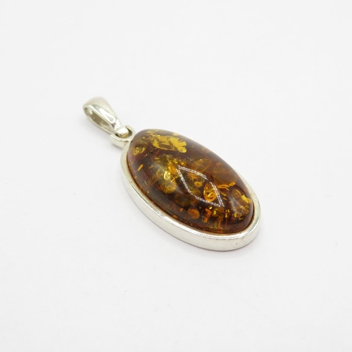 180 - Selection of silver and amber pendants HM  53.1g in total