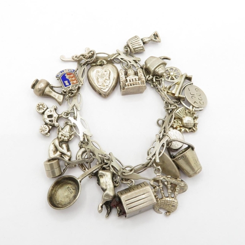 Silver charm bracelet HM with variety of charms  58.2g