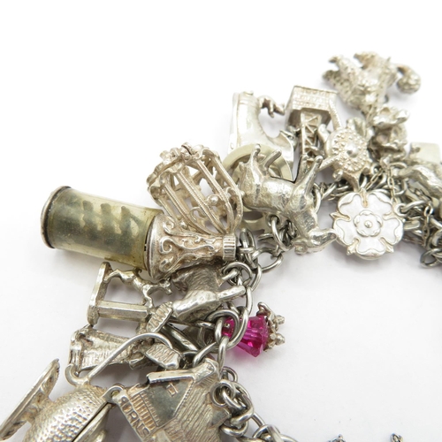 187 - Silver HM charm bracelet with selection of charms - some articulated  108.5g