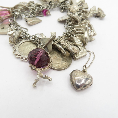 187 - Silver HM charm bracelet with selection of charms - some articulated  108.5g