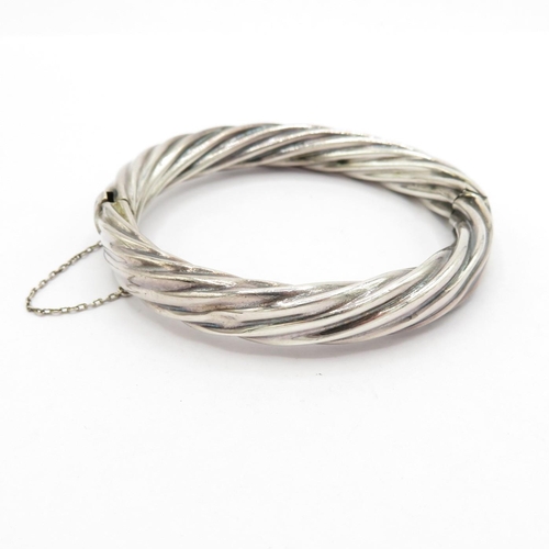 191 - Silver HM twist style bangle with safety chain  24.7g