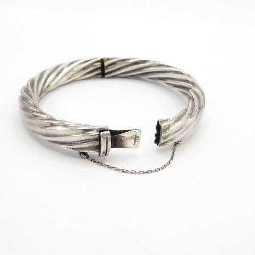 191 - Silver HM twist style bangle with safety chain  24.7g