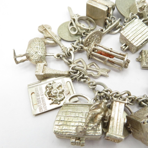 193 - Silver HM charm bracelet with selection of charms, some articulated  87.5g