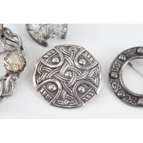 203 - Four silver Scottish brooches including Glasgow hallmark (49g)