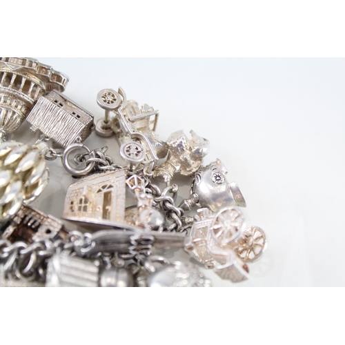 217 - Silver charm bracelet including souvenir charms (153g)