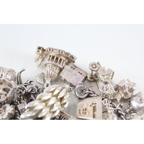 217 - Silver charm bracelet including souvenir charms (153g)