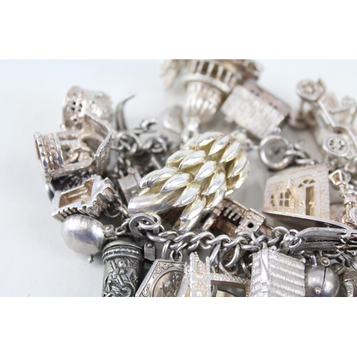 217 - Silver charm bracelet including souvenir charms (153g)