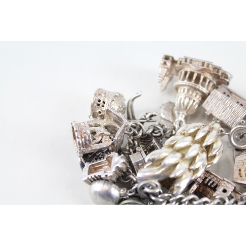 217 - Silver charm bracelet including souvenir charms (153g)