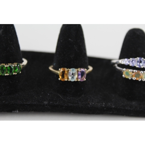 229 - A collection of silver gemstone rings including Diopside (20g)