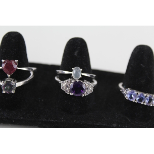 230 - A collection of silver gemstone rings including Ruby (21g)