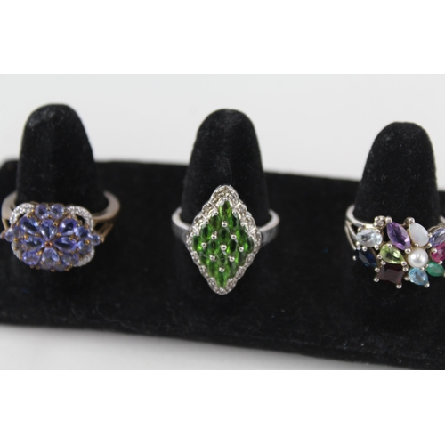 246 - A collection of silver gemstone rings including Opal (24g)