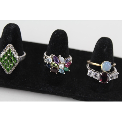 246 - A collection of silver gemstone rings including Opal (24g)