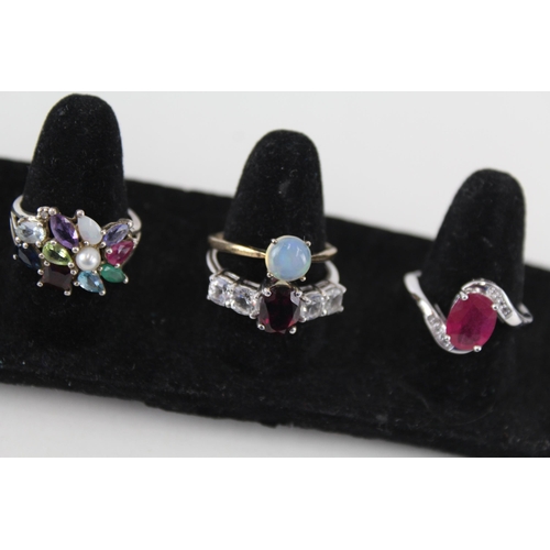 246 - A collection of silver gemstone rings including Opal (24g)