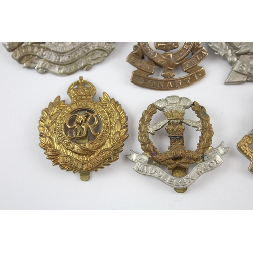 343 - Military Cap Badges x 10 inc. Canadian Rhodesia Regt Essex Etc