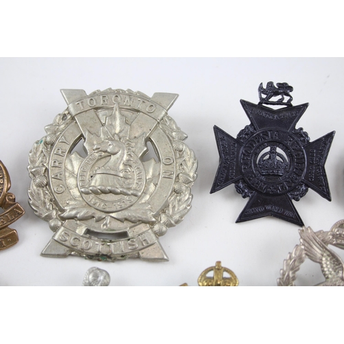 343 - Military Cap Badges x 10 inc. Canadian Rhodesia Regt Essex Etc