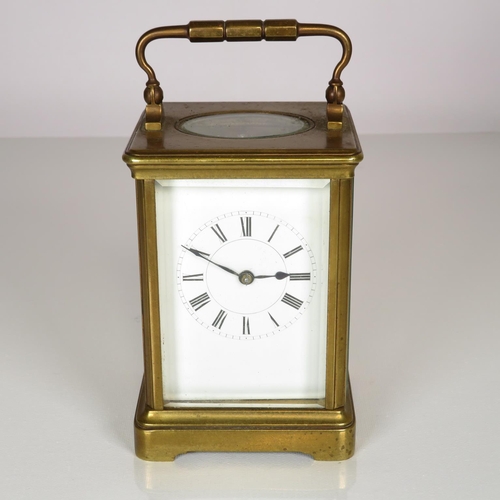 391 - Mid sized carriage clock with chiming mechanism - clock runs 130mm x 90mm