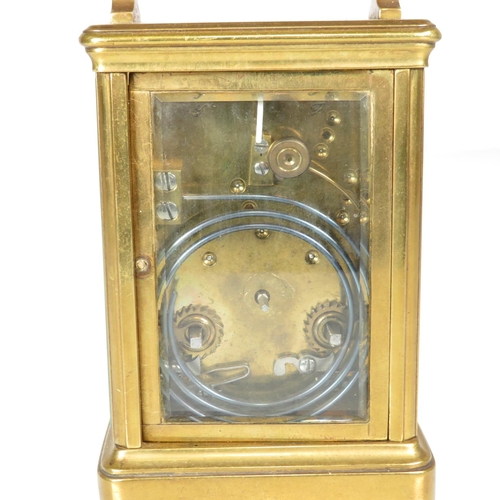 391 - Mid sized carriage clock with chiming mechanism - clock runs 130mm x 90mm