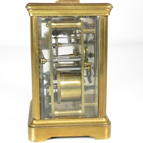 391 - Mid sized carriage clock with chiming mechanism - clock runs 130mm x 90mm