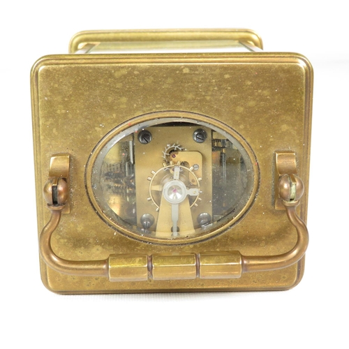 391 - Mid sized carriage clock with chiming mechanism - clock runs 130mm x 90mm