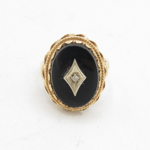 103 - 9ct gold diamond & black onyx dress ring with a decorative setting & English hallmarks (5.3g) Size  ... 