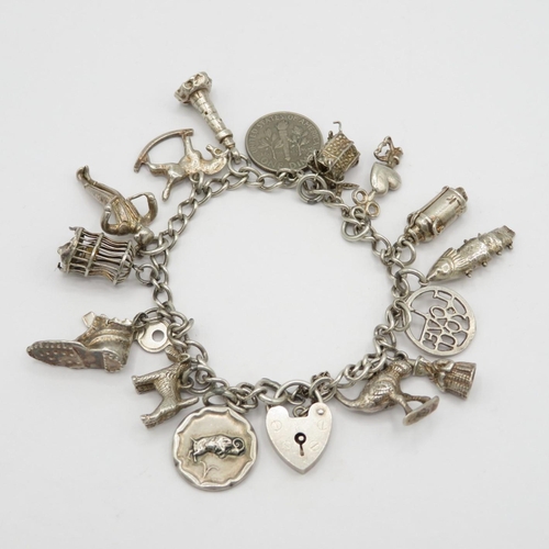 Fine charm bracelet with assorted charms in Silver 40.6g total weight
