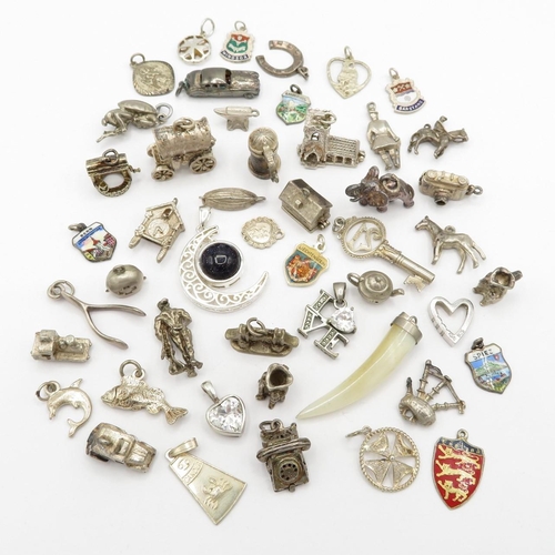 Bag of assorted silver charms, some enamelled, some articulated   131.8g  total weight