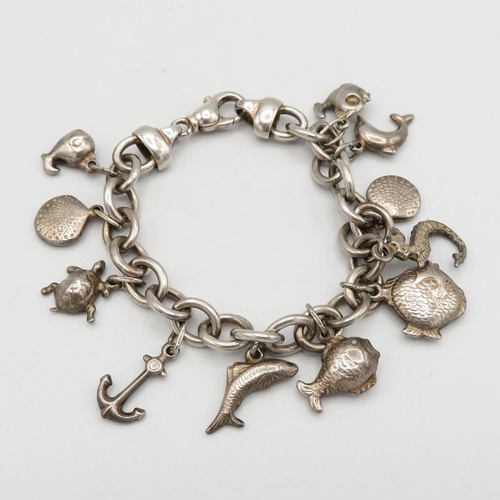 Silver charm bracelet with ocean themed charms  31.6g  total weight