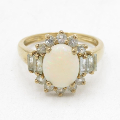9ct gold opal & vari-cut aquamarine dress ring in a claw setting (2.9g) Size  P