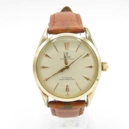 Tudor by Rolex Oyster Thin gents vintage gold tone wristwatch handwind 21 jewels working Tudor signed dial movement and case brown leather watch strap