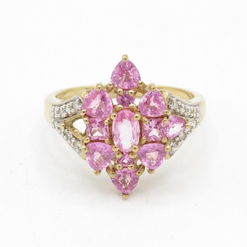 9ct gold vari-cut pink sapphire cluster cocktail ring with diamond set shoulders (3.2g) Size  O