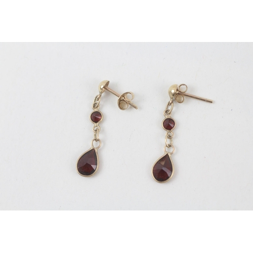 104 - 9ct gold garnet two stone dangle earrings  0.9 g