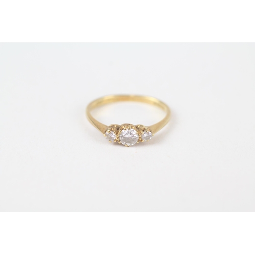 63 - 18ct gold round brilliant cut diamond three stone ring Size J 1.7 g