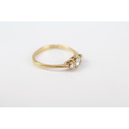 63 - 18ct gold round brilliant cut diamond three stone ring Size J 1.7 g