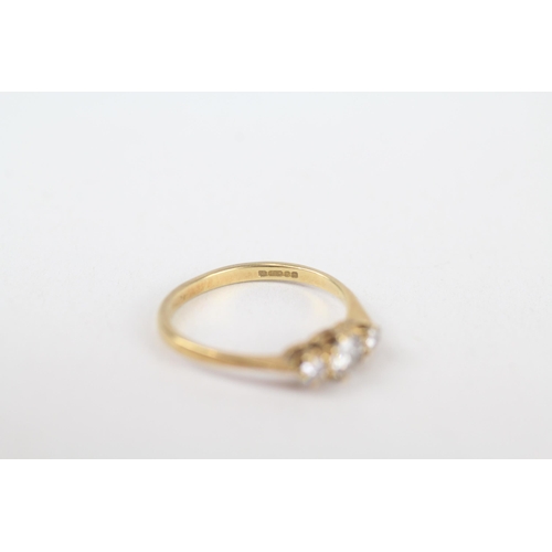 63 - 18ct gold round brilliant cut diamond three stone ring Size J 1.7 g