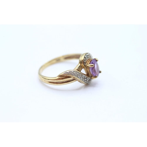 68 - 9ct gold amethyst single stone twist ring with diamond accent Size M 2.3 g