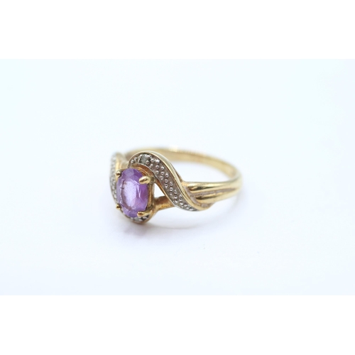68 - 9ct gold amethyst single stone twist ring with diamond accent Size M 2.3 g