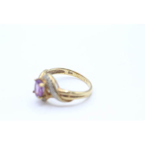 68 - 9ct gold amethyst single stone twist ring with diamond accent Size M 2.3 g