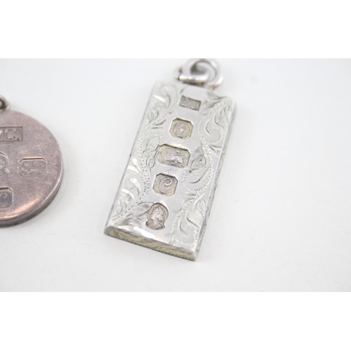 355 - Two sterling silver ingot pendants (44g)