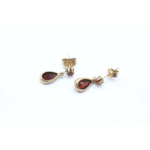 28 - 9ct gold pear cut garnet drop earrings with scroll backs   - 1.3 g