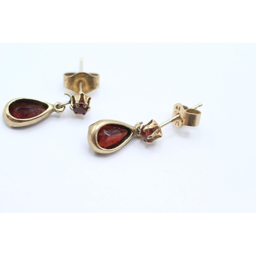 28 - 9ct gold pear cut garnet drop earrings with scroll backs   - 1.3 g