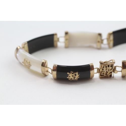 78 - 9ct gold mother & pearl & black onyx bracelet with Chinese symbols (10.8g)