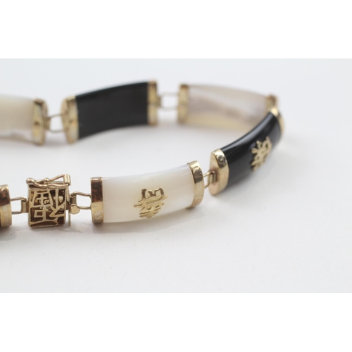 78 - 9ct gold mother & pearl & black onyx bracelet with Chinese symbols (10.8g)