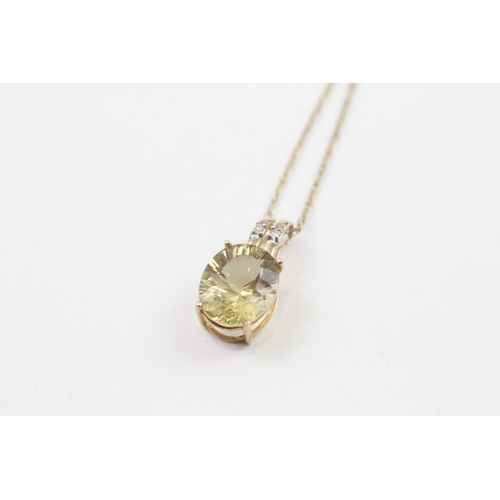 81 - 9ct gold oval cut citrine & diamond pendant necklace (1.9g)