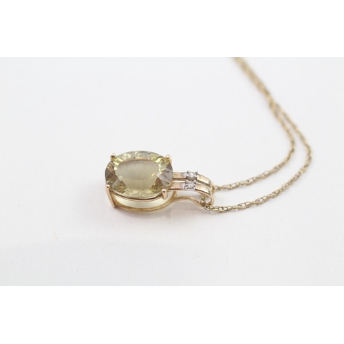 81 - 9ct gold oval cut citrine & diamond pendant necklace (1.9g)