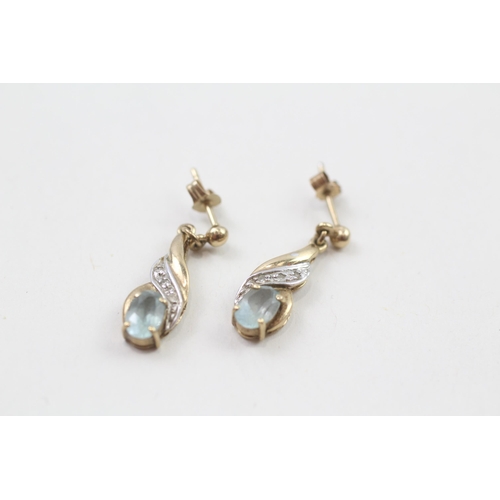 82 - 9ct gold blue topaz & diamond drop earrings with scroll backs (1.8g)